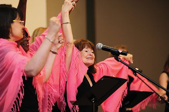 Members of the Keeler Women’s Center Theatre Troupe perform a song celebrating women for the 10th anniversary of the ministry. The center supports women of urban Kansas City, Kan.