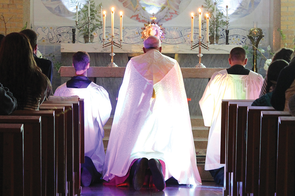Archbishop Joseph F. Naumann leads eucharistic adoration during a “Trust One Greater” event Nov. 3 on the campus of Benedictine College in Atchison.