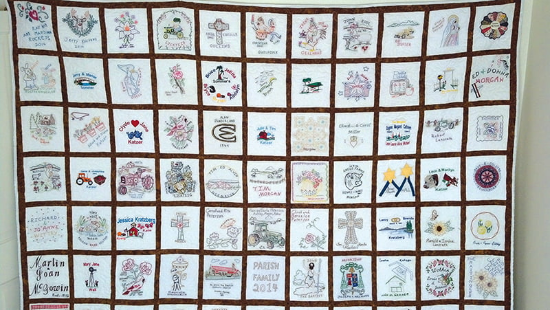 The quilt created by members of St. John the Baptist Parish in Greeley contains 121 squares and tells of the parish’s families. It will be raffled at St. John’s annual bazaar on Sept. 28.