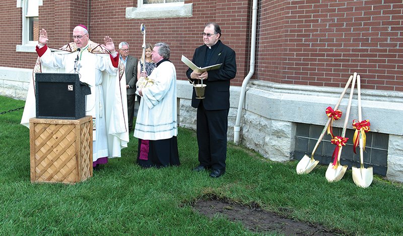 Archbishop Joseph F. Naumann presided at the site blessing and groundbreaking for the construction of a new handicap-accessible entryway, foyer and eucharistic adoration chapel on the north side of the church. With the archbishop are (from left) Jim Muckenthaler, Maryilyn Laird, Msgr. Gary Applegate and pastor Father Tom Dolezal. Photo by Joe Bollig