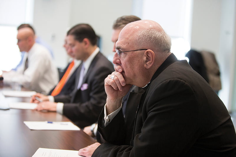 Archbishop Joseph F. Naumann meets with a group of 30 people at the Polsinelli law firm to found the Catholic Bar Association.  Photo by Doug Hesse. 