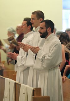Leaven photo by Susan McSpadden From left, Quentin Schmitz, Daniel Schmitz and Nathan Haverland were ordained transitional deacons on May 19 at Most Pure Heart of Mary Church in Topeka. The three will be ordained to the priesthood next year.