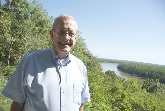 Elmer Fangman stands over the bend in the Missouri River near Benedictine College’s campus. Fangman oversaw the merger of St. Benedict’s College and Mount St. Scholastica College while he was dean of students at St. Benedict’s.