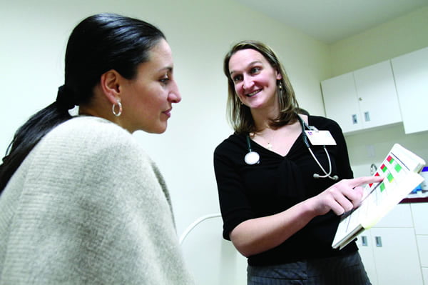 Dr. Anne Mielnik, founding director of Gianna — The Catholic Healthcare Center for Women, chats with patient Judith Guzman in the center’s newly opened office in New York Dec. 30, 2011. Located in midtown Manhattan, the center is dedicated to providing primary care, obstetrics, natural family planning and infertility treatment with a Catholic pro-life approach. (CNS photo/ Gregory A. Shemitz)