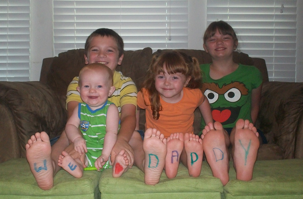 Betty Ann Battson looks for creative activities for her whole family to do together. Here, she decorated the feet of: back row, 9-year-old Justin and 12-year-old Libby, and in front, 10-month-old Patrick and 4-year-old Faith. They gave the picture to their dad, Brian Battson, for Father’s Day and he keeps it in a frame at work. The Battsons, parishioners of St. Patrick Parish in Kansas City, Kan., stayed close to home this summer instead of going on vacation.