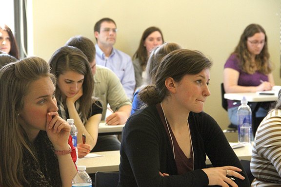 Benedictine College students Michela Brooks, left, and Rachel Wemhoff, listen to a speaker at Benedictine College’s Institute for Missionary Activity’s Symposium on Advancing the New Evangelization. The two-day event, included Archbishop Joseph F. Naumann; Bishop Robert C. Morlino, bishop of Madison, Wis.; Dr. Jonathan Reyes, executive director for the U.S. Conference of Catholic Bishops’ Department of Justice, Peace and Human Development; and Curtis Martin, president and founder of the Fellowship of Catholic University Students.
