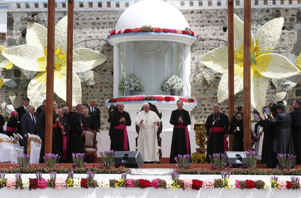 Pope Francis greets the crowd during a meeting with clergy, religious men and women, and seminarians at El Quinche National Marian Shrine in Quito, Ecuador, July 8. (CNS photo/Paul Haring)