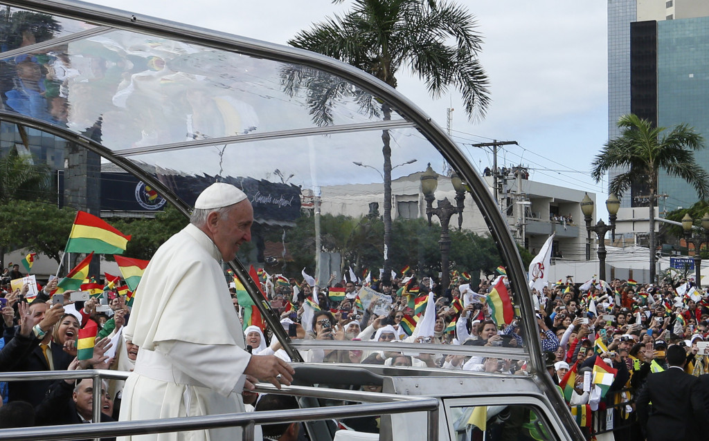 Pope Francis greets the crowd as he arrives to celebrate Mass in Christ the Redeemer Square in Santa Cruz, Bolivia, July 9. (CNS photo/Paul Haring) See POPE-EUCHARIST July 9, 2015.