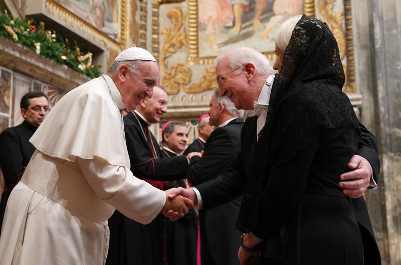 Pope Francis exchanges greetings with Ken Hackett, U.S. ambassador to the Holy See, and his wife, Joan, during a meeting with ambassadors to the Holy See at the Vatican Jan. 13. (CNS photo/Paul Haring) 