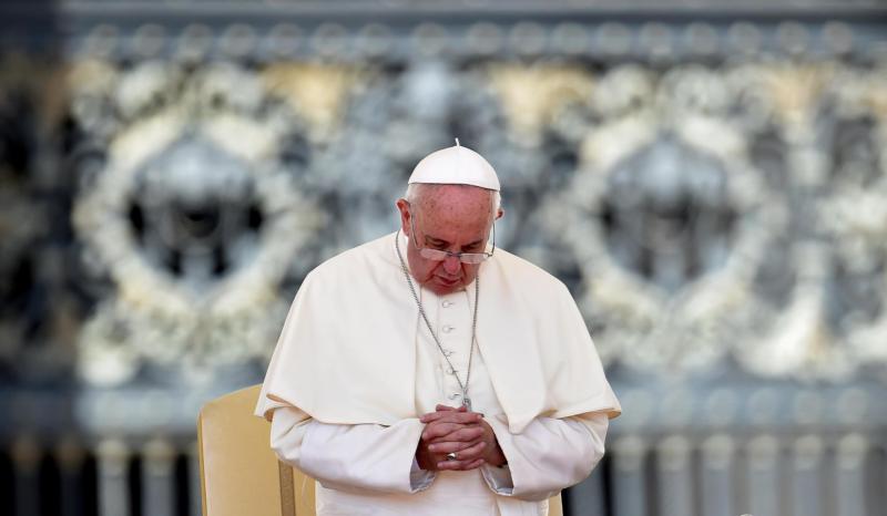 Pope Francis prays as he leads his weekly audience in St. Peter's Square at the Vatican Aug. 26. (CNS photo/Ettore Ferrari, EPA) 