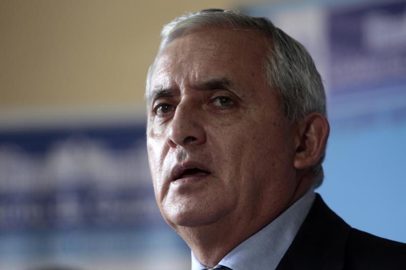 Guatemalan President Otto Perez Molina speaks in Guatemala City June 11. The Guatemalan bishops' conference called for Perez to step down as corruption scandals consumed the country's political class and citizens took to the streets in protest. (CNS photo/Esteban Biba, EPA)  