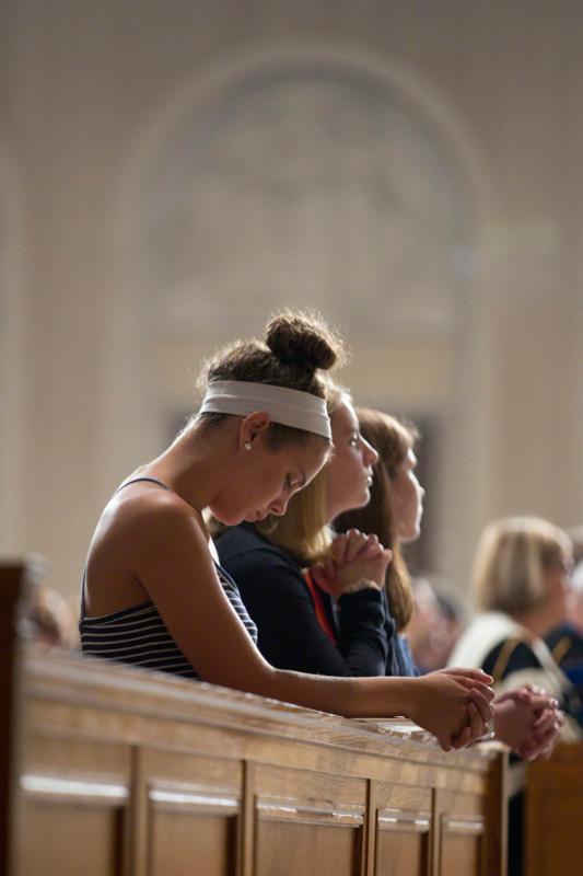 Students of The Catholic University of America and others pray during the school's annual Mass of the Holy Spirit, Sept. 3, at the Basilica of the National Shrine of the Immaculate Conception in Washington. (CNS photo/Jaclyn Lippelmann, Catholic Standard) 