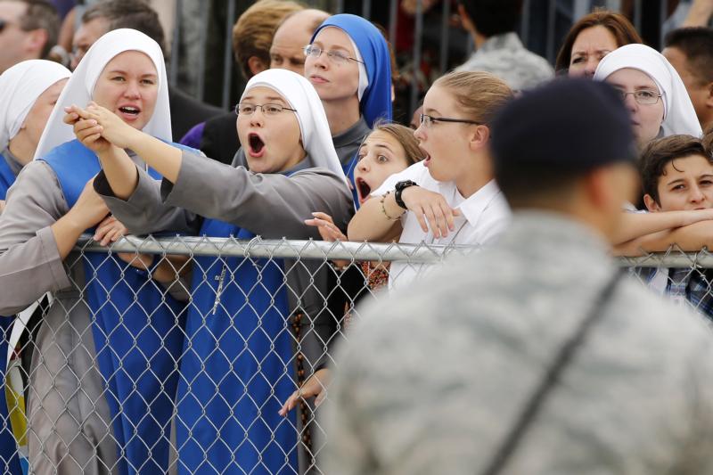 Nuns and others show their excitement as they wait for Pope Francis to emerge from a short meeting with U.S. President Barack Obama upon the pope's arrival at Joint Base Andrews outside Washington Sept. 22. (CNS photo/Jonathan Ernst, pool) 