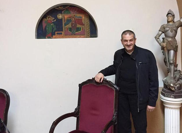 Father Jacques Mourad poses for a photo Nov. 11 in the reception area at Our Lady of the Annunciation Church in Beirut, Lebanon. (CNS photo/Doreen Abi Raad)