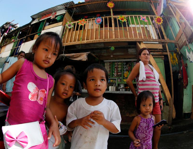 Children are seen next to shanties in Manila, Philippines, Nov. 17. (CNS photo/Francis R. Malasig, EPA) 