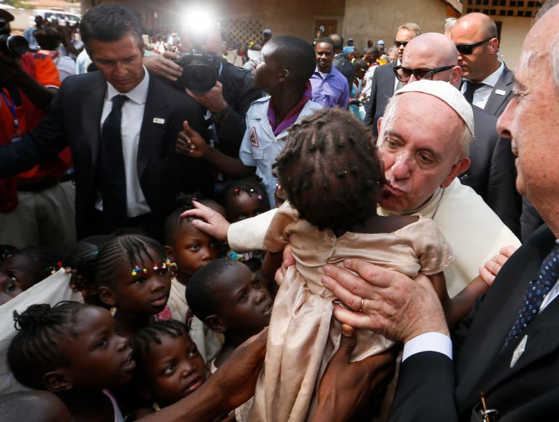 Pope Francis kisses a child as he visits a refugee camp in Bangui, Central African Republic, Nov. 29. (CNS photo/Paul Haring)