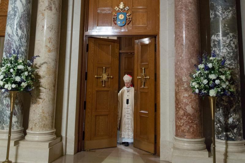 Washington Cardinal Donald W. Wuerl opens the Holy Door Dec. 8 at the Basilica of the National Shrine of the Immaculate Conception in Washington. The rite of opening the door came at the start of the church's Year of Mercy. (CNS photo/Jaclyn Lippelmann, Catholic Standard)