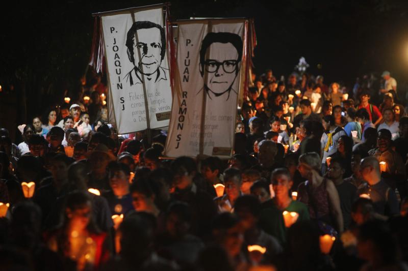 People participate in the "little lanterns march" at the Central American University in San Salvador during the 2015 commemoration of the 26th anniversary of the massacre of six Jesuit priests and two women, murdered in November 1989 by a military commando. (CNS photo/Oscar Rivera, EPA)