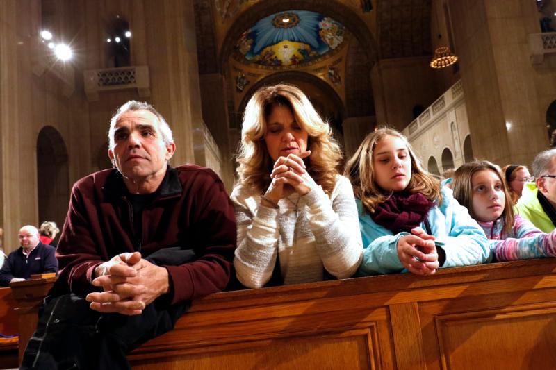 People pray prior to the opening Mass of the National Prayer Vigil for Life at the Basilica of the National Shrine of the Immaculate Conception in Washington Jan. 21. The all-night vigil is held before the annual March for Life, which this year marked the 43rd anniversary of the Supreme Court's Roe v. Wade decision that legalized abortion across the nation. (CNS photo/Gregory A. Shemitz)