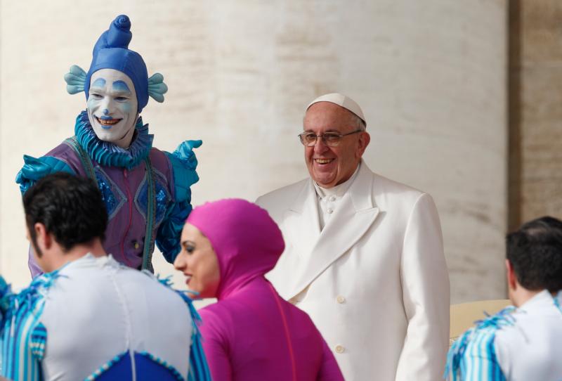 Circus members greet Pope Francis after their performance during the pope's general audience in St. Peter's Square at the Vatican Jan. 27. (CNS photo/Paul Haring)