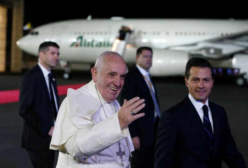 Pope Francis walks with Mexican President Enrique Pena Nieto during a welcoming ceremony at Benito Juarez International Airport in Mexico City Feb. 12. (CNS photo/Paul Haring)