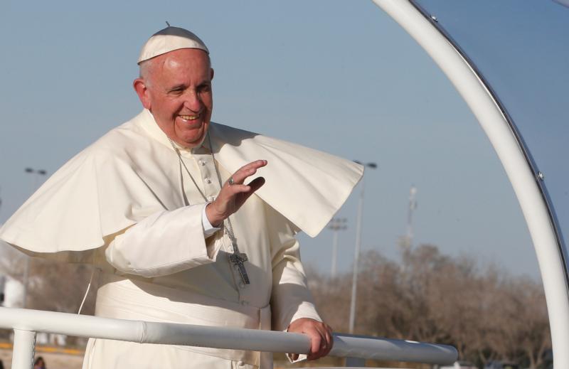 Pope Francis waves from the popemobile after praying at a cross on the border with El Paso, Texas, in Ciudad Juarez, Mexico, Feb. 17. (CNS photo/Paul Haring)