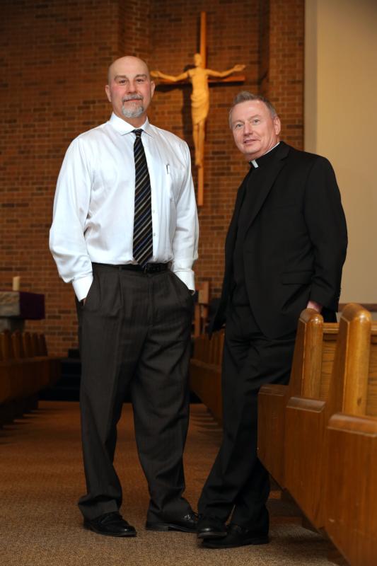 Father Neil Kookoothe, pastor of St. Clarence Parish in North Olmsted, Ohio, and former death-row inmate Joe D'Ambrosio pose for a photo Feb. 11. (CNS photo/William Rieter)