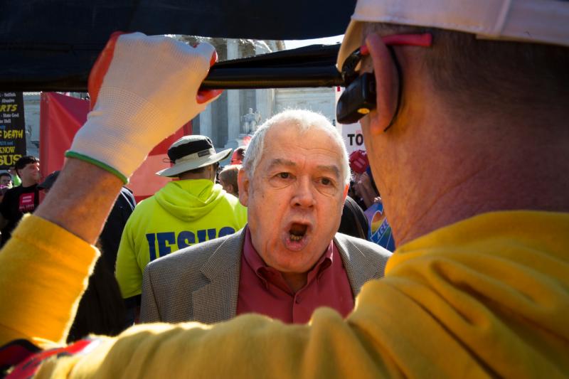 Men argue outside the U.S. Supreme Court in Washington in this April 28, 2015, file photo. (CNS photo/Tyler Orsburn)