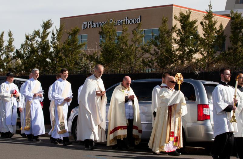 Denver Archbishop Samuel J. Aquila leads 1,800 Catholics in a eucharistic procession around Planned Parenthood in Denver March 5. (CNS photo/Andrew Wright, Denver Catholic)