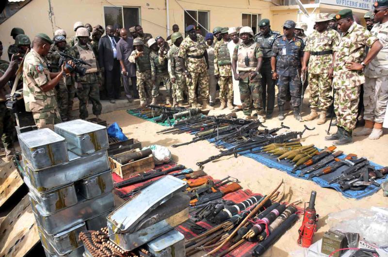 Nigerian President Goodluck Jonathan and military inspect weapons seized by Islamic militants in Baga, Nigeria, in this Feb. 26, 2015, file photo. (CNS photo/Stringer, EPA)