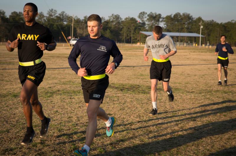 Father Lukasz J. Willenberg, second from left, runs with soldiers March 8 during morning physical training at Fort Bragg in Fayetteville, N.C. Father Willenberg, who holds the rank of captain, is a chaplain at the U.S. Army post and trains as a noncombat paratrooper with the 82nd Airborne Division. (CNS photo/Chaz Muth)