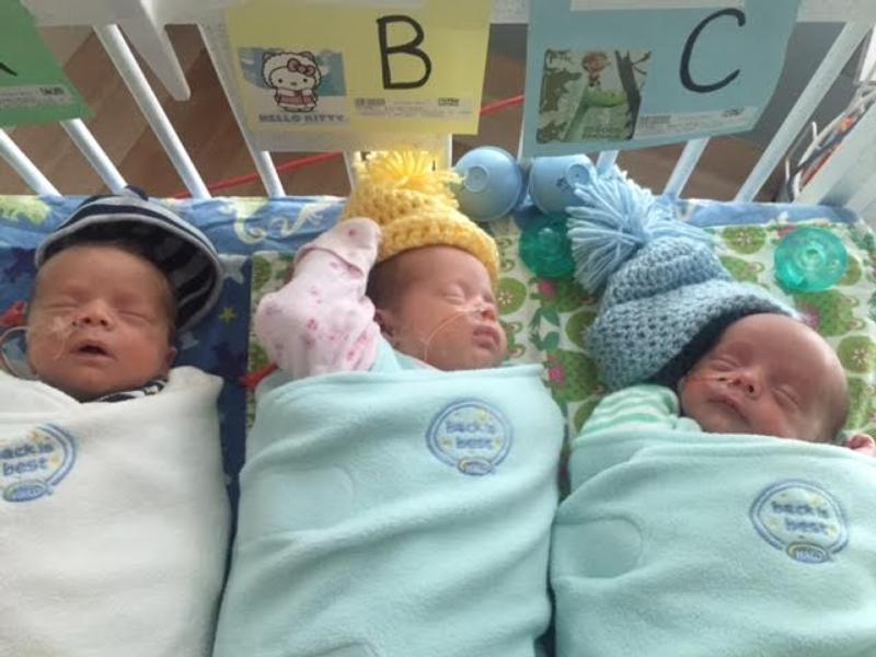 Sebastien, Sophe-Elizabeth and Sidney, the adopted triplets of Kevin and Cari Campbell, are pictured in the neonatal intensive care at a hospital in Oregon. The children were baptized Easter morning at Resurrection Church in Dubuque, Iowa. (CNS photo/Campbell family)