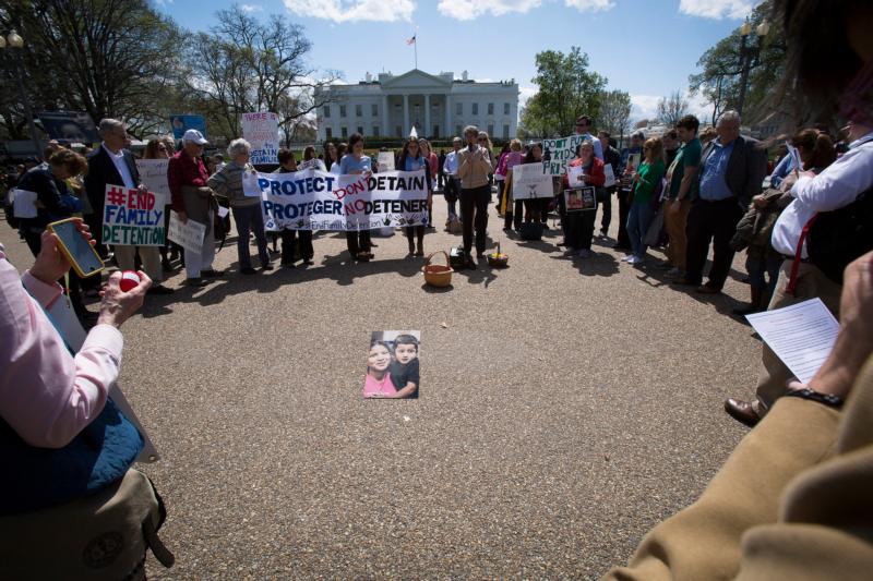 Demonstrators gather in front of the White House in Washington March 28 to call on the Obama administration to put an end to the detention of immigrant families who are seeking asylum. (CNS photo/Tyler Orsburn)