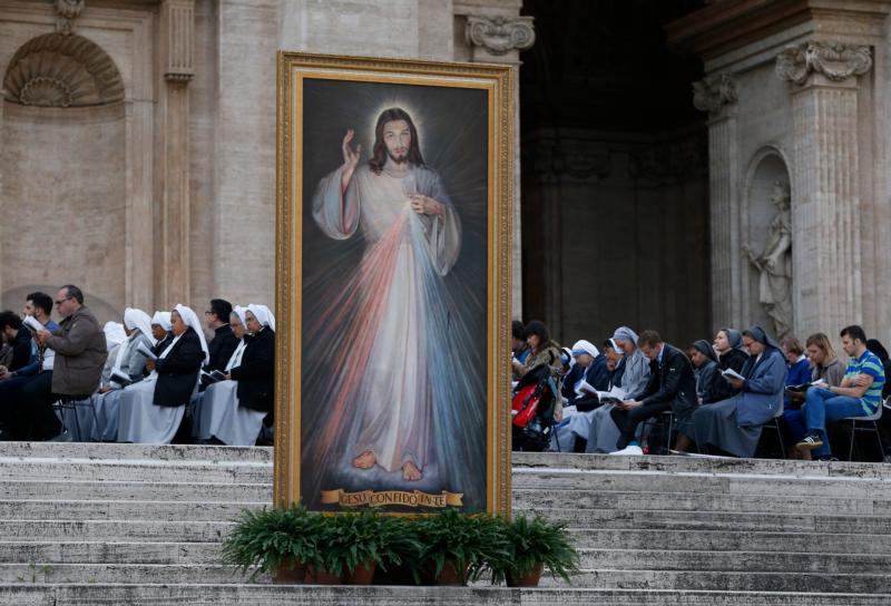 An image of Jesus of Divine Mercy is seen as Pope Francis leads a prayer service on the eve of the feast of Divine Mercy in St. Peter's Square at the Vatican April 2. (CNS photo/Paul Haring)
