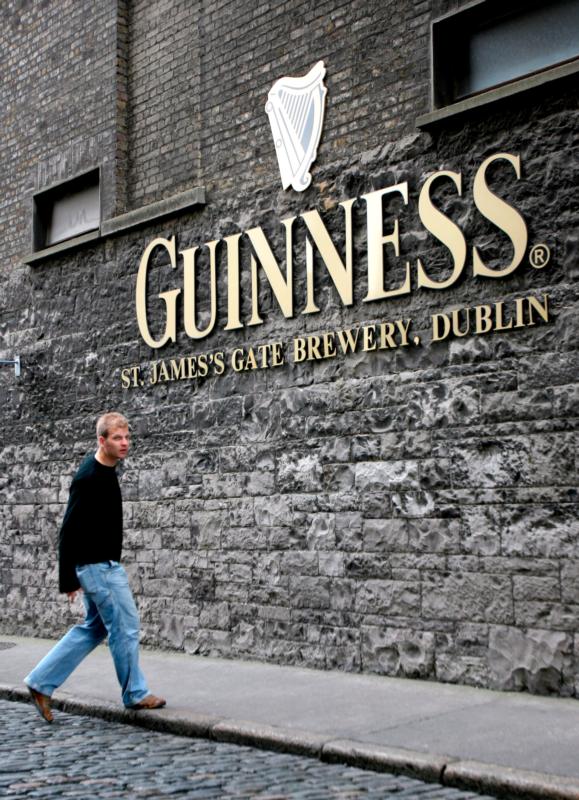A young man walks outside the St. James's Gate Guinness Storehouse in 2007 in Dublin. Young people in Ireland are increasingly looking for an alternative to the drinking scene, with up to 8,000 teenagers signing up to the Pioneer Association last year. (CNS photo/Andy Rain, EPA)