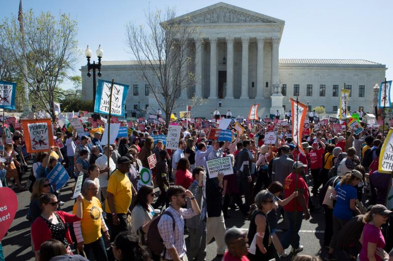 Demonstrators gather outside the U.S. Supreme Court in Washington April 18 as the justices hear oral arguments  in a challenge by several states to President Barack Obama's deferred deportation programs. (CNS photo/Tyler Orsburn)