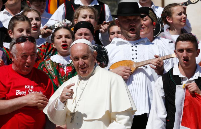 Pope Francis meets traditional singers from Croatia during his general audience in St. Peter's Square at the Vatican April 20. (CNS photo/Paul Haring)