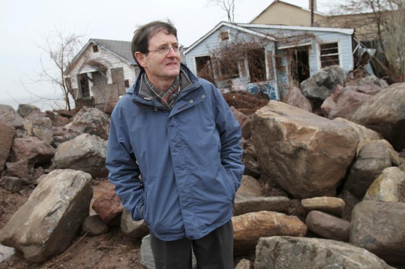Patrick Jordan, former managing editor of the Catholic Worker newspaper, stands near abandoned cottages that were once part of the Spanish Camp enclave in the Staten Island borough of New York Dec. 9, 2012. Jordan and his wife Kathleen, who were close associates of Catholic social activist Dorothy Day, had lived in one of the cottages. Day was a part-time resident of the community and later in her life spent much of her time there. (CNS photo/Gregory A. Shemitz)