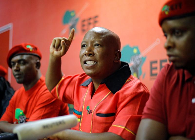 Julius Malema, leader of the Economic Freedom Fighters, gestures during a March 31 news conference in Johannesburg following the South African Constitutional Court's finding that President Jacob Zuma had violated the country's constitution. War rhetoric from South African political leaders could incite election violence and civil war, a South African bishop warned. (CNS photo/Kim Lundbrook, EPA)