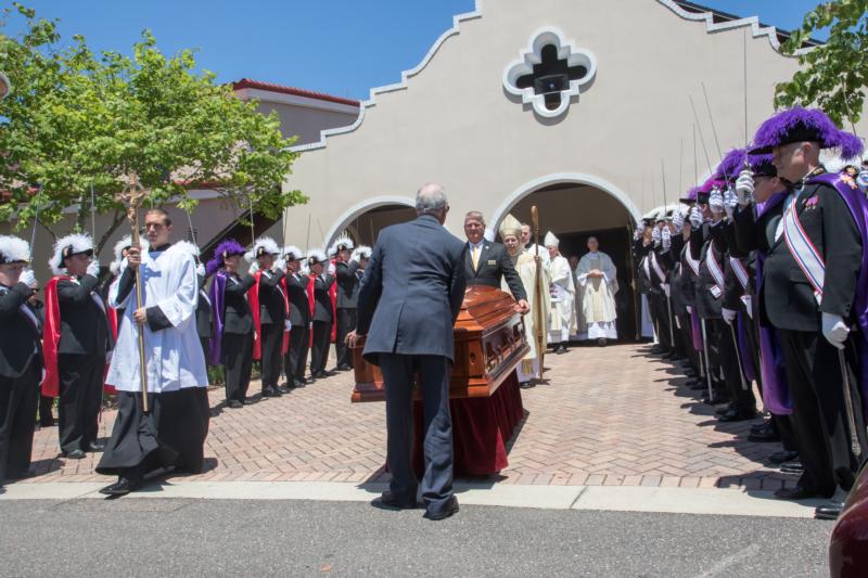 Pallbearers walk out the casket of Father Rene Robert following his April 25 funeral Mass at San Sebastian Church in St. Augustine, Fla. The 71-year-old priest was found dead April 18 in Burke County, Ga., after being reported missing April 12 when he did not show up for a church function. (CNS photo/Diocese of St. Augustine)
