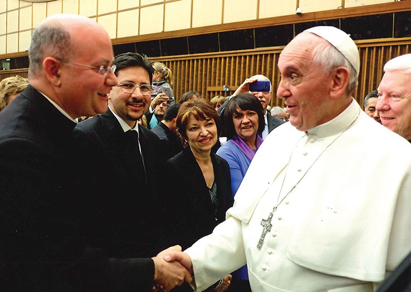 Father Joseph Carola, SJ, meets with Pope Francis. Father Joseph, an internationally known professor, will lead a retreat at Holy Angels Parish in Basehor April 18-20.