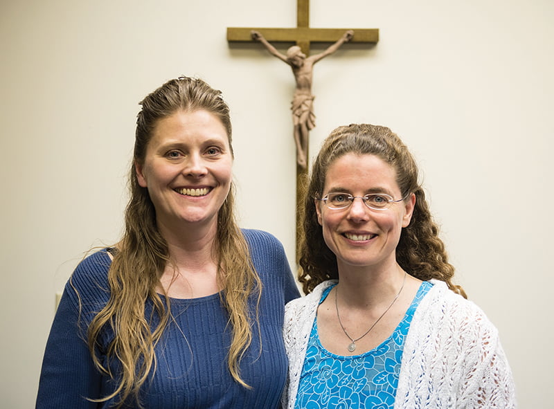 Angelique Pritchett, M.D. (left), and Terese Bauer, M.D., both board-certified in family medicine, were inspired to found a clinic that would offer quality medical care with a Catholic ethos. Their business model seeks to lower health care costs by offering various clinic membership plans. Leaven photo by Joe Bollig