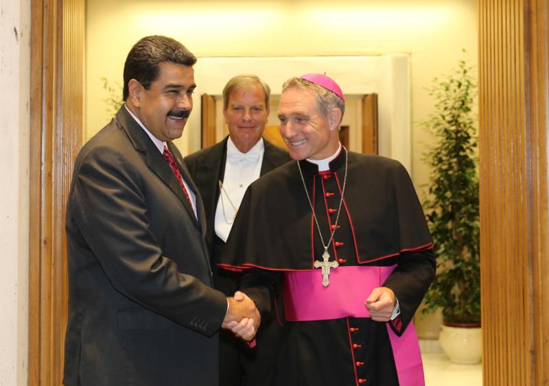 Venezuelan President Nicolas Maduro is greeted by Archbishop Georg Ganswein, prefect of the papal household, prior to an Oct. 24 private meeting between Maduro and Pope Francis at the Vatican. (CNS photo/Miraflores Palace handout via EPA) See POPE-MADURO-VISIT Oct. 25, 2016.
