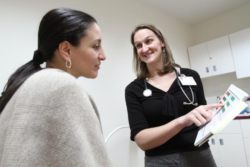 Dr. Anne Nolte, right, a family physician with the National Gianna Center for Women's Health and Fertility in New York, is pictured with a patient in 2009. A pair of Catholic physicians argue that changes in the way health care is paid for and stronger relationships between doctors and their patients will do more to improve people's health and uphold the sanctity of life than bureaucratic government-run programs and expensive insurance policies. (CNS photo/Gregory A. Shemitz) See WASHINGTON-LETTER-HEALTH-CARE Nov. 3, 2016.