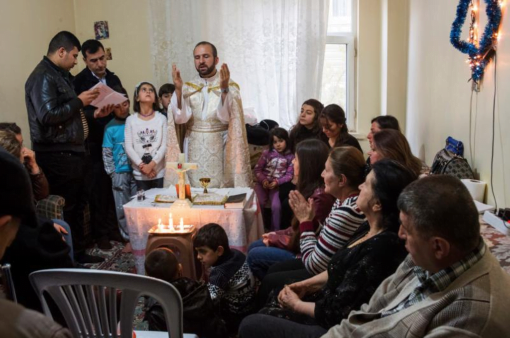 Chaldean Father Remzi Diril, also known as Father Adday, celebrates Mass at an apartment in Kirsehir, Turkey, Nov. 10. (CNS photo/Oscar Durand)