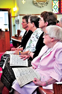 From left to right, Benedictine Sisters Anne Shepard, Delores Dolezal, Rose Marie Stallbaumer and Mary Ethel Burley participate in the June 26 Mass honoring their order’s 135-year service to Sts. Peter and Paul Parish in Seneca.