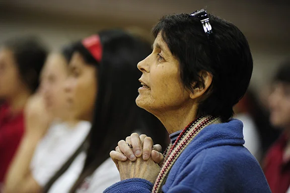 Despite being diagnosed with stage IV colon cancer in 2010, Mary Perrini has battled on and continues to work as director of campus ministry at Bishop Miege High School in Roeland Park.