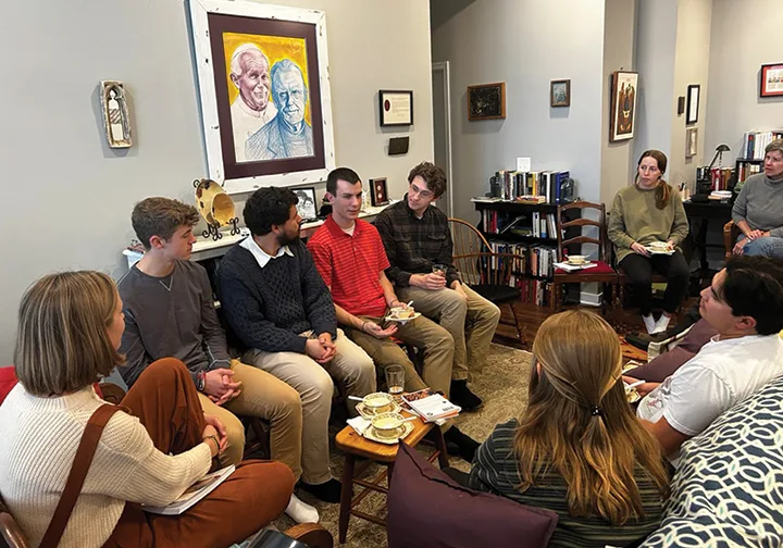 Benedictine College students gather at Tory and Elizabeth Baucums’ apartment to talk about life and learn about human love as part of the John Paul II Fellowship. LEAVEN PHOTO BY JACK FIGGE